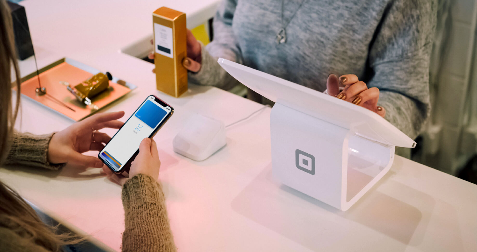 Woman paying with phone