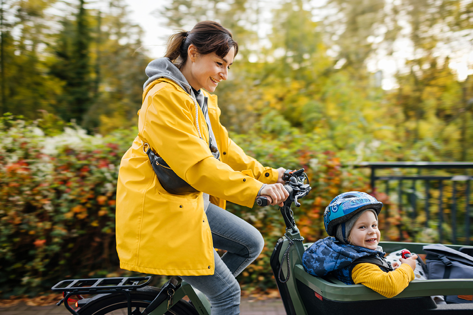 A happy mother and child enjoying a bike ride