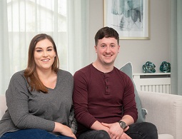 couple sat on sofa