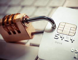 Padlock attached to a bank card to represent security